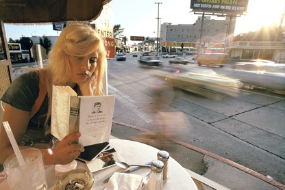 Sylvie Vartan sitting at a café terrace, on Sunset Boulevard
