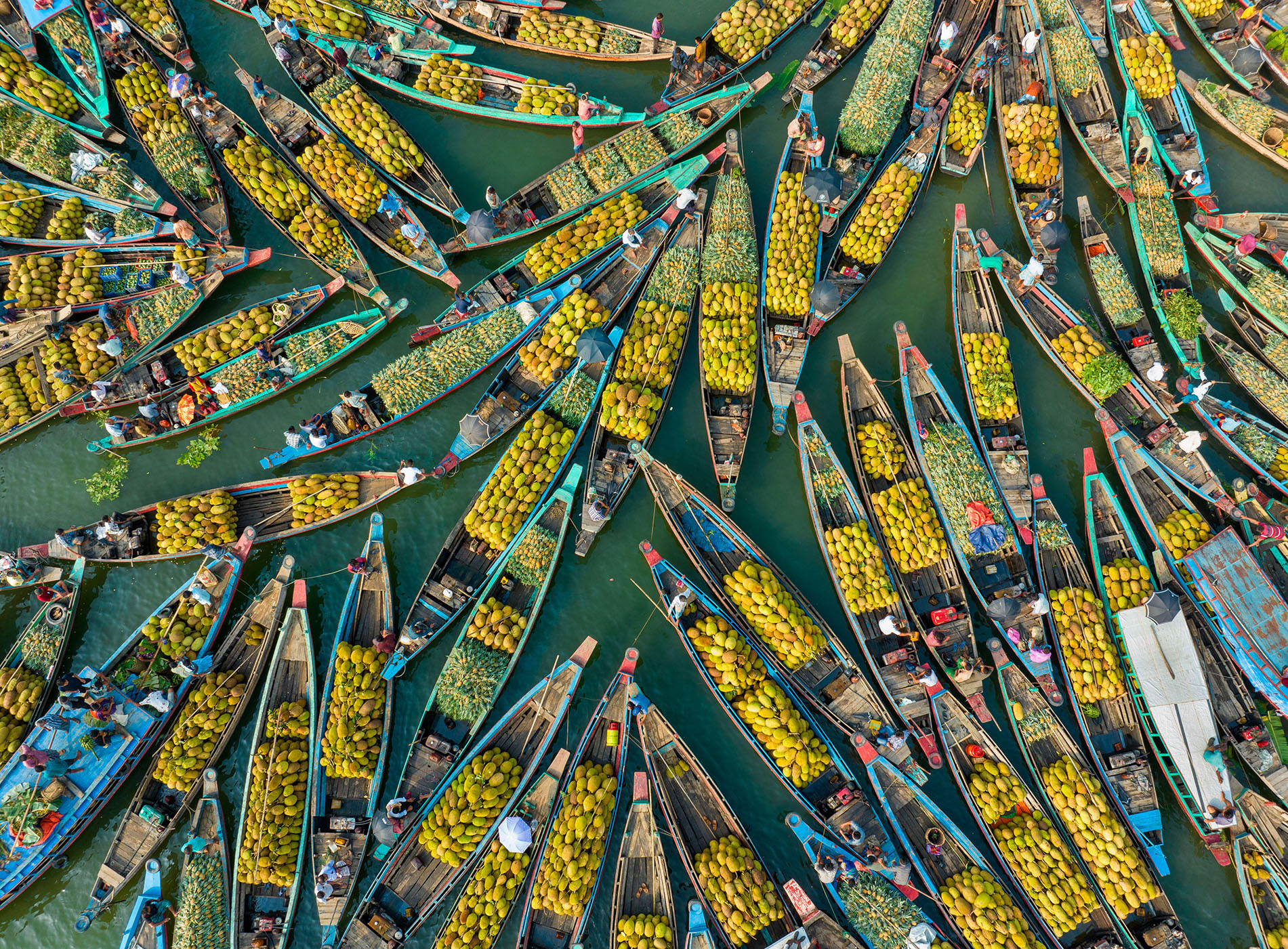 Aerial view of floating market of seasonal fruits on the boats in Kaptai Lake, Rangamati, Bangladesh.