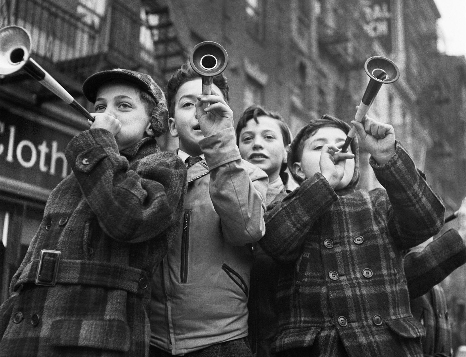 Four Boys blowing horns on New Year's Day