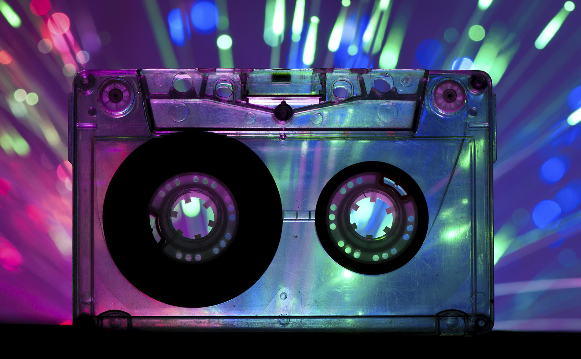 Transparent Cassette tape and blue pink color disco light background