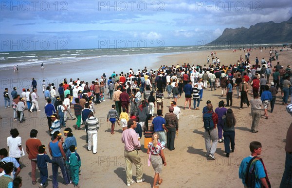 The Strand, Cape Town, South Africa, 1989

water, sand, beach, coloured people, demonstrations against segregation, fighting apartheidm multiracial