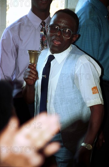 Tata Farrington rings his bell during singing and dancing at his church in Pietermaritzburg, KwaZulu-Natal, South Africa. african christians, churches, christianity, worship,