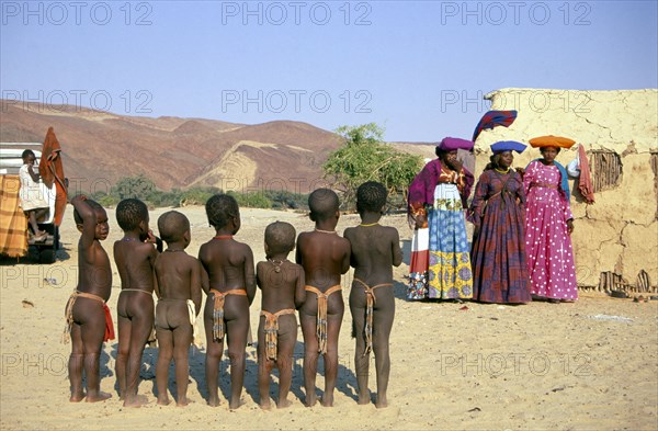 HERERO'S POSING AT PURROS, KAOKOLAND, NAMIBIA