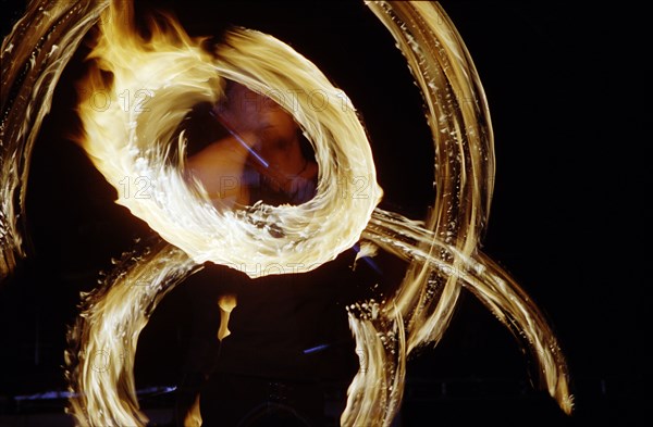 A fire dancer gets into the zone during a performance at the Cindi "Celebration of Light" at the National Botanical Gardens in Pietermaritzburg. The event aims to raise funds for the work of Children in Distress (Cindi) a network of NGOs and CBOs working to mitigate the impact of HIV/AIDS in the city. Pietermaritzburg stands at the heart of the worst hit region in the world in terms of HIV infection rates among pregnant women.