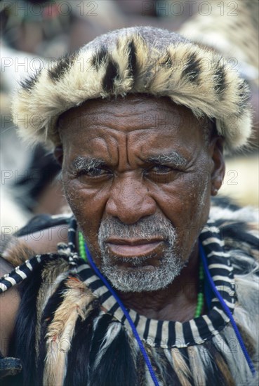 Heritage Day in South Africa Coincides with the Zulu celebration of Shaka Day in honour of the founding king of the Zulu nation. On this day the Zulu King, currently King Goodwill Zwelithini, the Zulu Royal Family, the chiefs and large crowds of Zulu subjects in traditional clothing gather to celebrate. There are speeches, but there is also much dancing and singing. 

It was during the speeches when all the press cameras were turned on the King and Zulu politicians of the likes of former vice president Jacob Zuma, that I managed to get close to a group of amakhosi (chieftains) to take individual portraits. It is a sign of disrespect to look an older man, and particularly an "inkosi" in the eye so I had to work carefully. I kept low and my subjects were fortunately gracious.