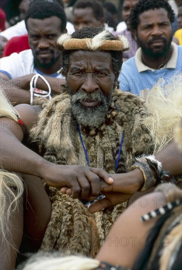 Heritage Day in South Africa Coincides with the Zulu celebration of Shaka Day in honour of the founding king of the Zulu nation. On this day the Zulu King, currently King Goodwill Zwelithini, the Zulu Royal Family, the chiefs and large crowds of Zulu subjects in traditional clothing gather to celebrate. There are speeches, but there is also much dancing and singing. 

It was during the speeches when all the press cameras were turned on the King and Zulu politicians of the likes of former vice president Jacob Zuma, that I managed to get close to a group of amakhosi (chieftains) to take individual portraits. It is a sign of disrespect to look an older man, and particularly an "inkosi" in the eye so I had to work carefully. I kept low and my subjects were fortunately gracious.