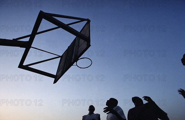 In the suburb of Corofina Nord, Bamako, Mali, there is a dusty field which facilitates a corporate life. Young people in particular gather at the field in the late afternoon to play sport - basketball and soccer - socialise, and interact. Staying in a guest house adjoining the field I had the priviledge of participating and observing a community at play. 

Rival women teams battle it out on the baskerball court.