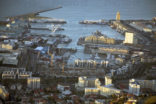Cape Town's waterfront has undergone intensive gentrification over the past 15 years turning the harbour area into an entertainment and residential complex with hotels, apartments, shopping centres and the Two Oceans Aquarium.