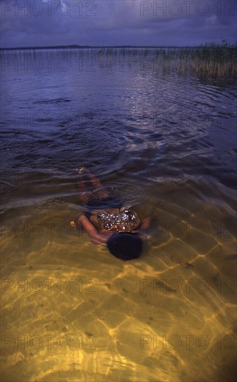 swimmer -underwater in a lake