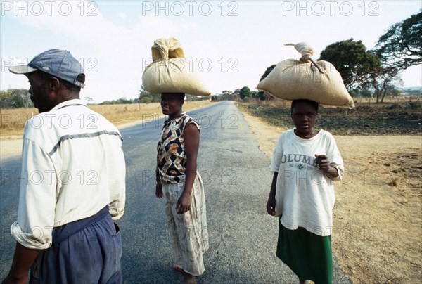 Johannes Moses (right) walked 10km with Trinis and Tabetha Alick to a neighbouring farm, where they bought the bags of grain from workers who had swept it off the threshing floor. All they had had for breakfast that morning was tea