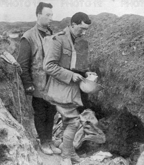 World War I: Chaplain of the lst Munsters saying a burial prayer