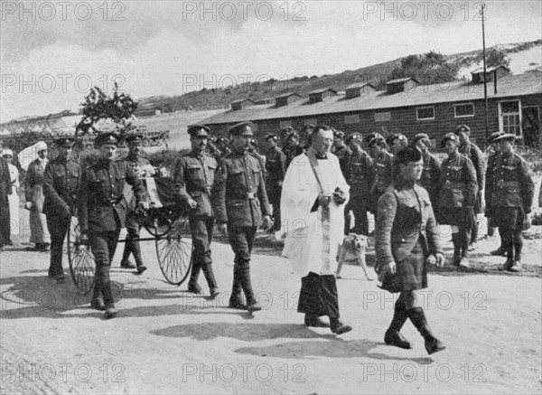 World War I: Army chaplain officiating at funeral of nurse killed during air raid on British base