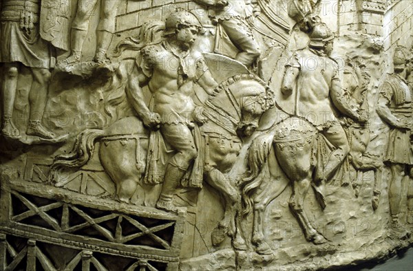 Roman cavalry crossing a wooden bridge