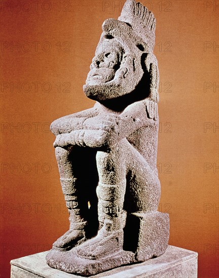 Aztec sculpture of seated male figure