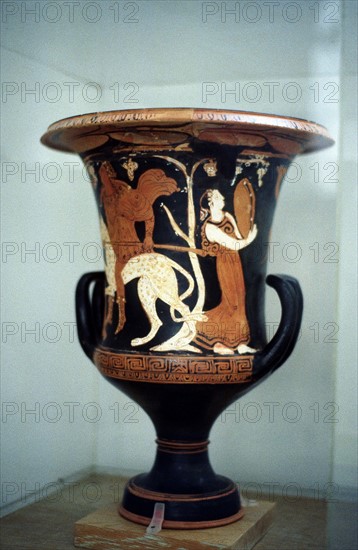 Greek female dancer with musical instrument similar to tambourine