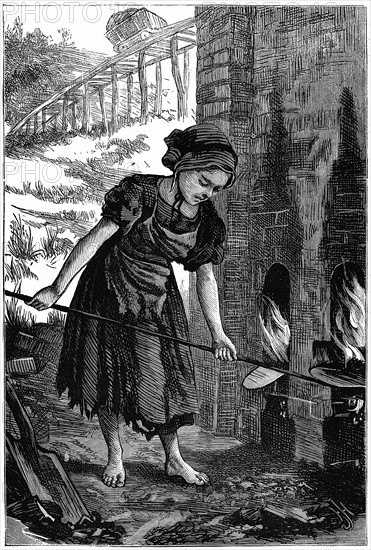 Young girl tending the fire holes of a brick kiln