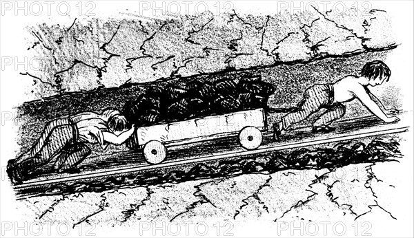 Boy 'putters' moving coal in a narrow seam - Lancashire