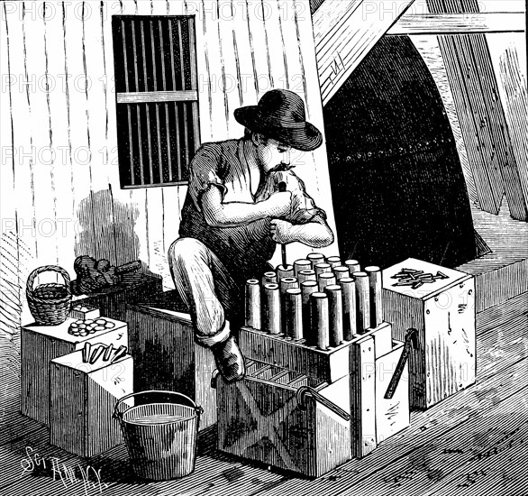 Inserting detonators into cartridges of dynamite for blasting Flood Rock, East River