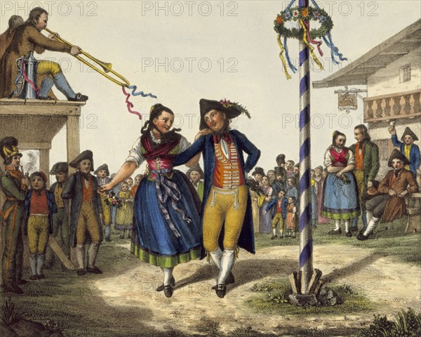 Popular Festivities: Young couple dancing round May