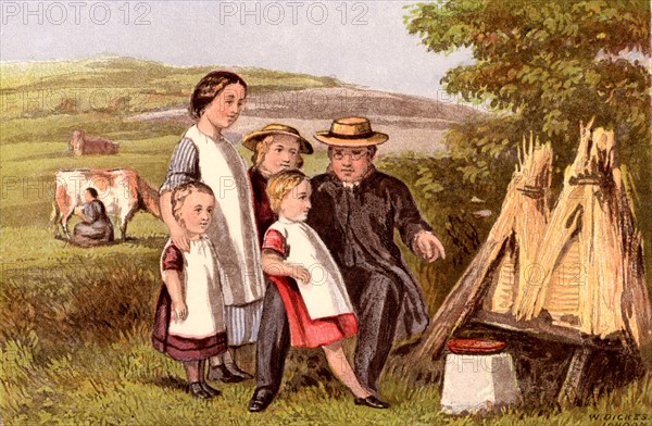 Children Being Shown Straw Beehives