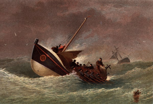 Lifeboat in the livery of the Royal National Lifeboat Institution in heavy seas returning from a rescue mission