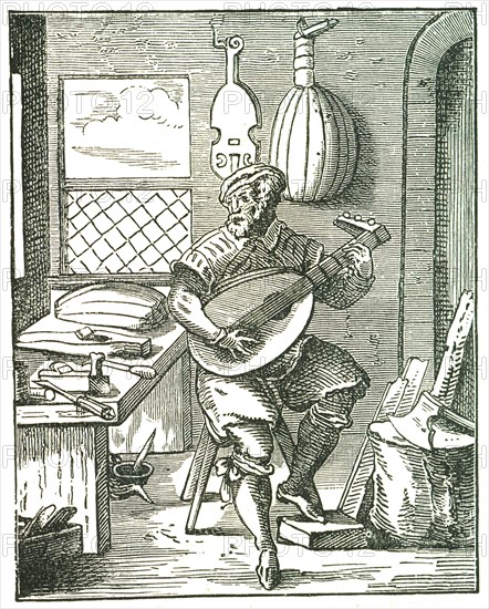 Lute Maker in his workshop