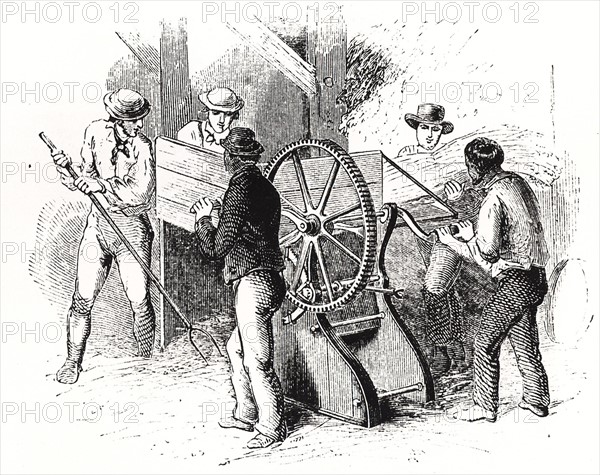Hand-powered threshing machine