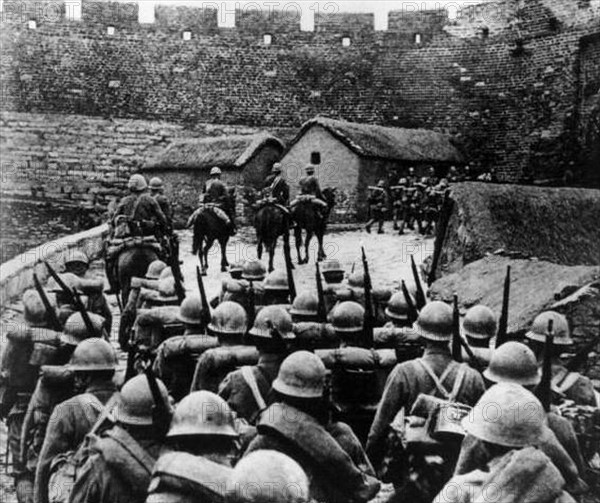 Japanese soldiers enter a city in China, Circa 1937