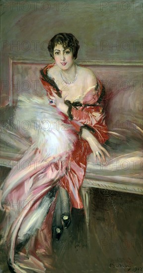 Boldini, Jeune femme en rouge dans un studio d'artiste