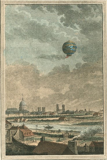 Montgolfier-style balloon in flight over Paris, France
