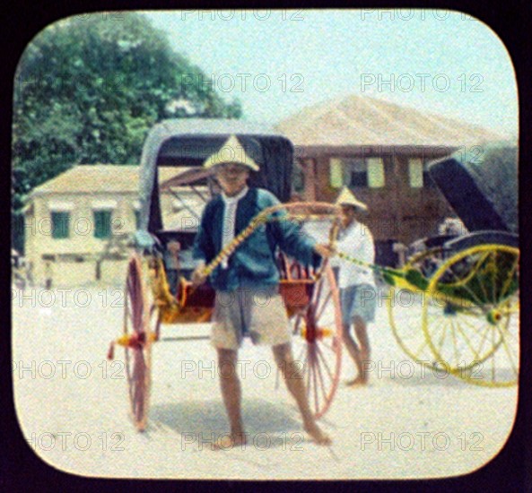 Two rickshaw drivers with their vehicles: Japan, 1895