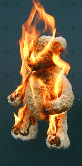 A child's teddy bear set alight