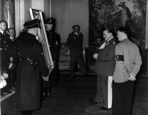 Hermann Göring shows a confiscated painting to Adolf Hitler
