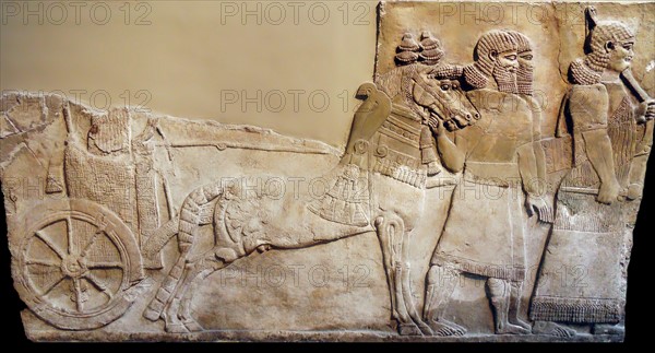 Chariot with wheel depicted in a stomne relief from Nimrud