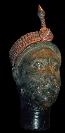 Brass head with a beaded crown and plume