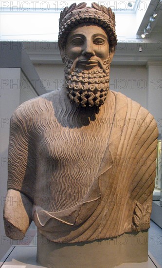 Colossal limestone statue of a bearded man