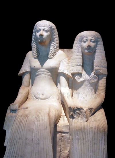 Limestone statue of a husband and wife