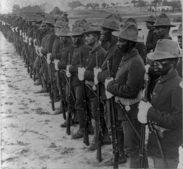 Some of our brave collared boys who helped to free Cuba"  Formation of Black soldiers, after Spanish-American War