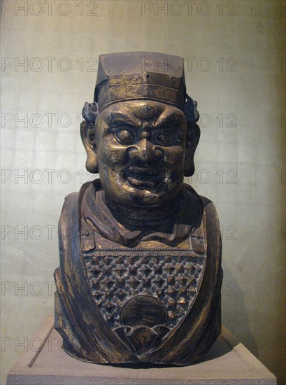 Gilt bronze head of a Buddhist guardian figure