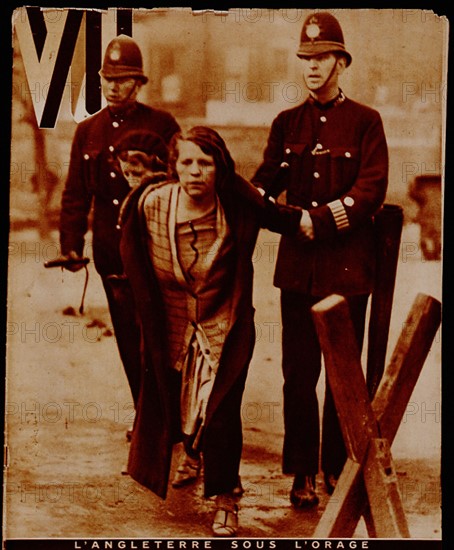 Great Depression in Britain 1929-1936. In 1931 Britain left the Gold Standard. Social benefits, the wages of government workers, and naval pay, were all cut.   Demonstrations were countrywide. Here a female demonstrator is arrested outside the British Museum, London.