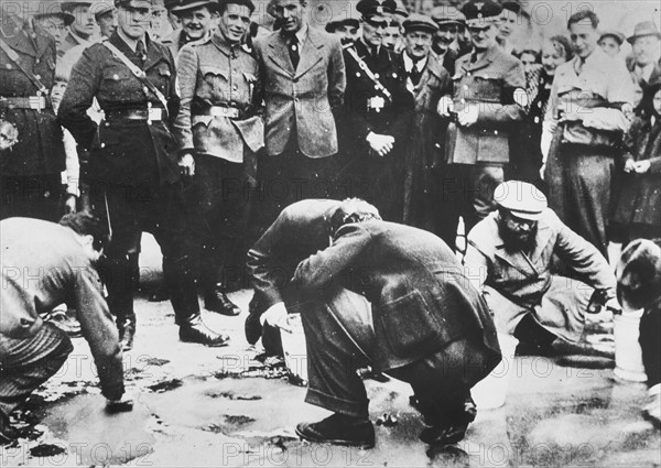 Austrian Nazis and local residents humiliating Jews