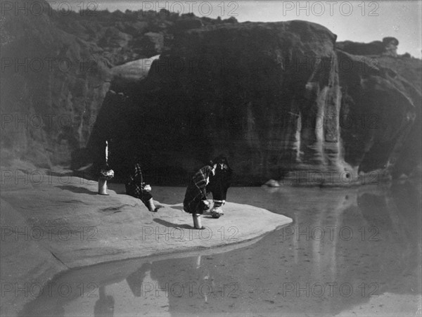 Four Acoma Indians gather to collect water