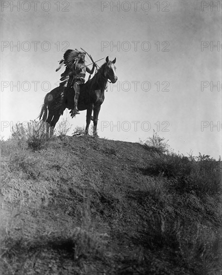 Native American Indian man in feather headdress