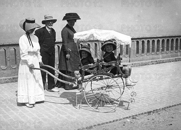 French woman pushing a pram