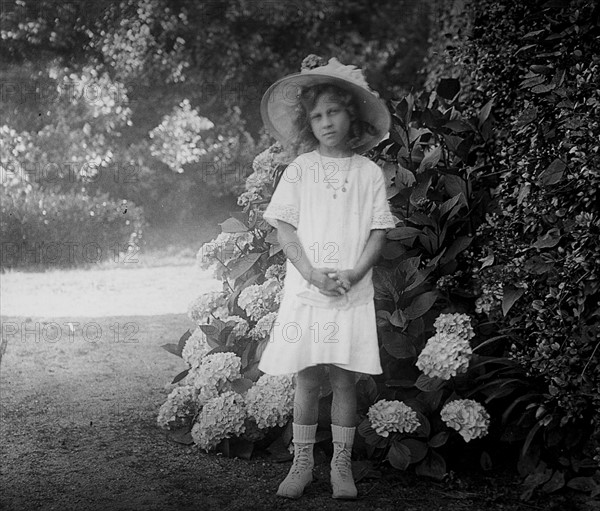 French girl in a garden