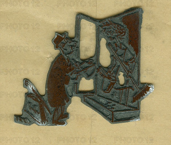 Lead block used to print a cartoon in a newspaper