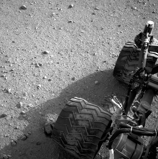 Soil clinging to the right middle and rear wheels of NASA's Mars rover Curiosity