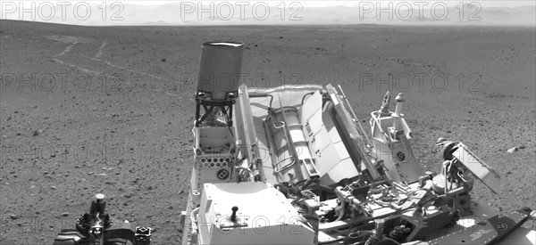 NASA's Mars rover Curiosity drove about 70 feet and then took images with its Navigation Camera that are combined into this scene, which includes the fresh tracks.
