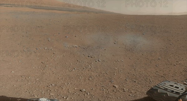 This is a portion of the first color 360-degree panorama from NASA's Curiosity rover, made up of thumbnails, a mountain at the center of Gale Crater called Mount Sharp, can be seen in the distance.