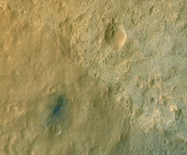 This color-enhanced view of NASA's Curiosity rover on the surface of Mars was taken by the HiRISE on NASA's Mars Reconnaissance Orbiter as the satellite flew overhead.